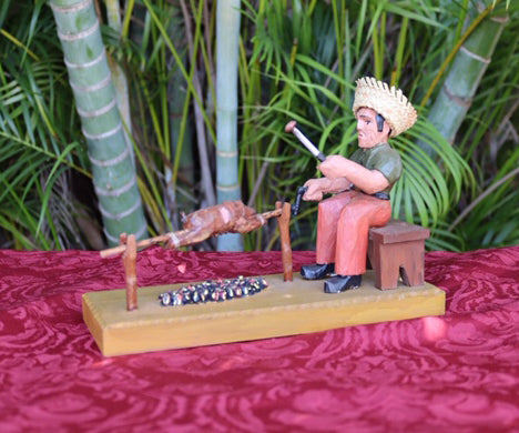 Jibarito asando un lechon por Jose Orta
